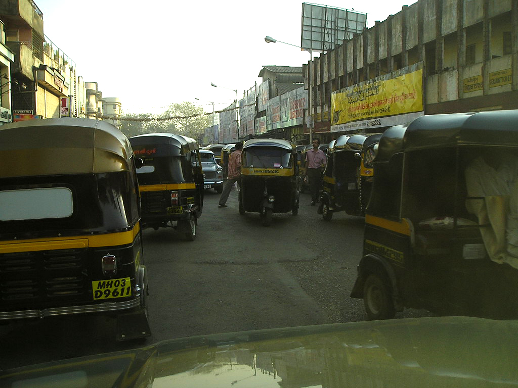 Rickshaws moving through Mumbai